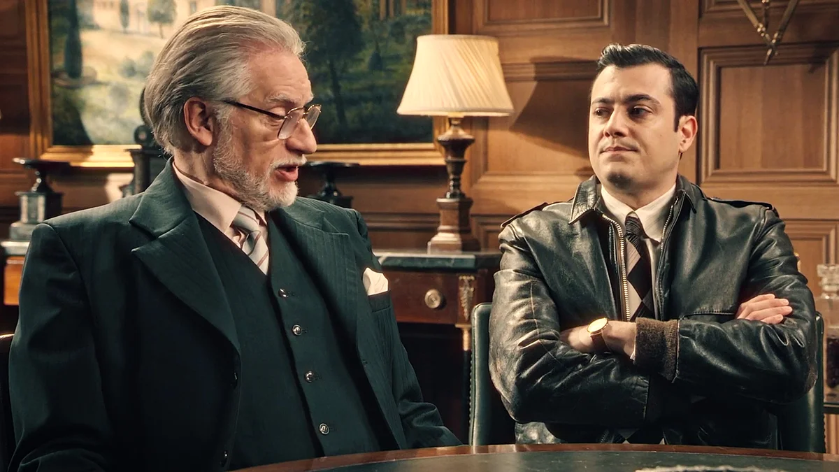 La sala de reuniones del estudio estaba envuelta en un aire de tensión palpable. Tasio, el productor de Sueños de Libertad